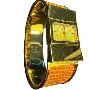 Hermes Gold Tone Bangle Watch with Brown Orange Lizard Accent